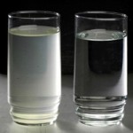 one glass of cloudy water and one clear glass of water