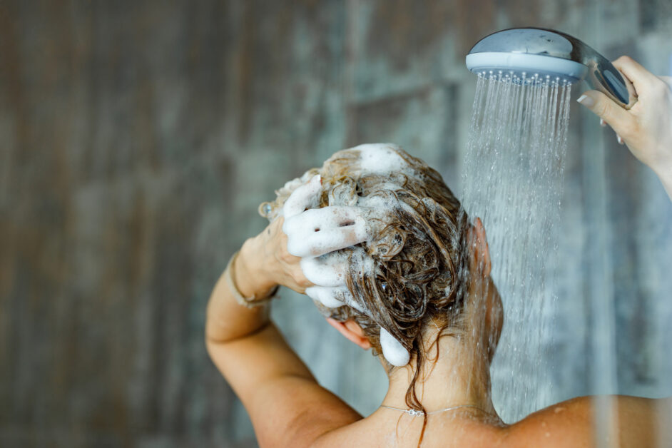 woman washing her hair with a shampoo