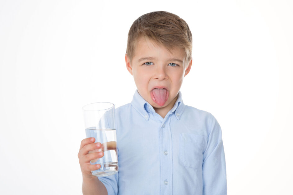 boy refusing to drink water