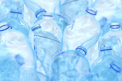 pile of crumpled plastic water bottles