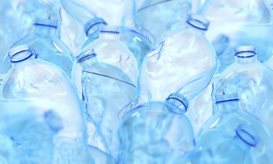 pile of crumpled plastic water bottles